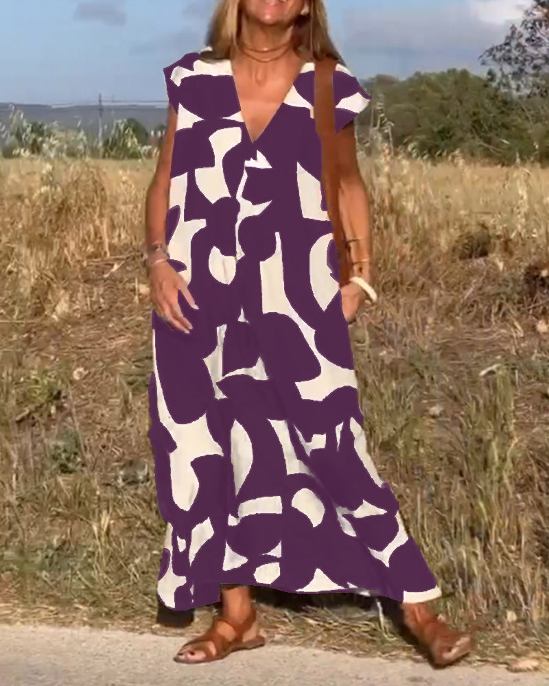 NAOMI™ | Lange Geprinte Jurk met V-hals en Uitlopende Pasvorm voor een Zomerse Look