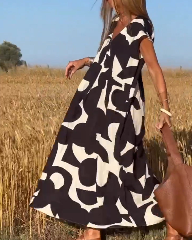 NAOMI™ | Lange Geprinte Jurk met V-hals en Uitlopende Pasvorm voor een Zomerse Look