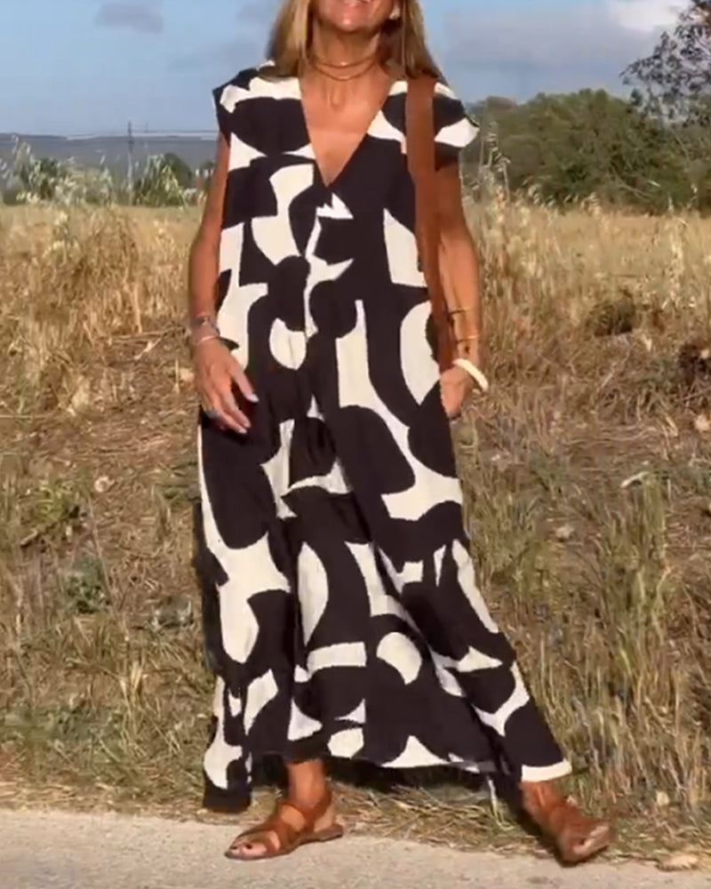 NAOMI™ | Lange Geprinte Jurk met V-hals en Uitlopende Pasvorm voor een Zomerse Look