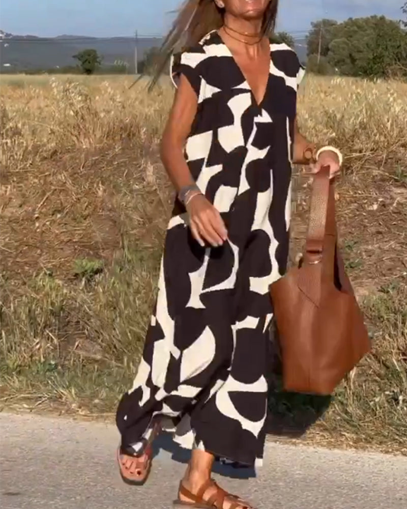 NAOMI™ | Lange Geprinte Jurk met V-hals en Uitlopende Pasvorm voor een Zomerse Look