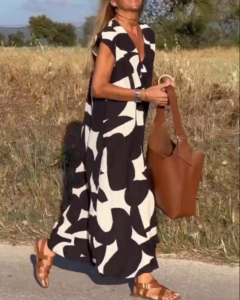NAOMI™ | Lange Geprinte Jurk met V-hals en Uitlopende Pasvorm voor een Zomerse Look