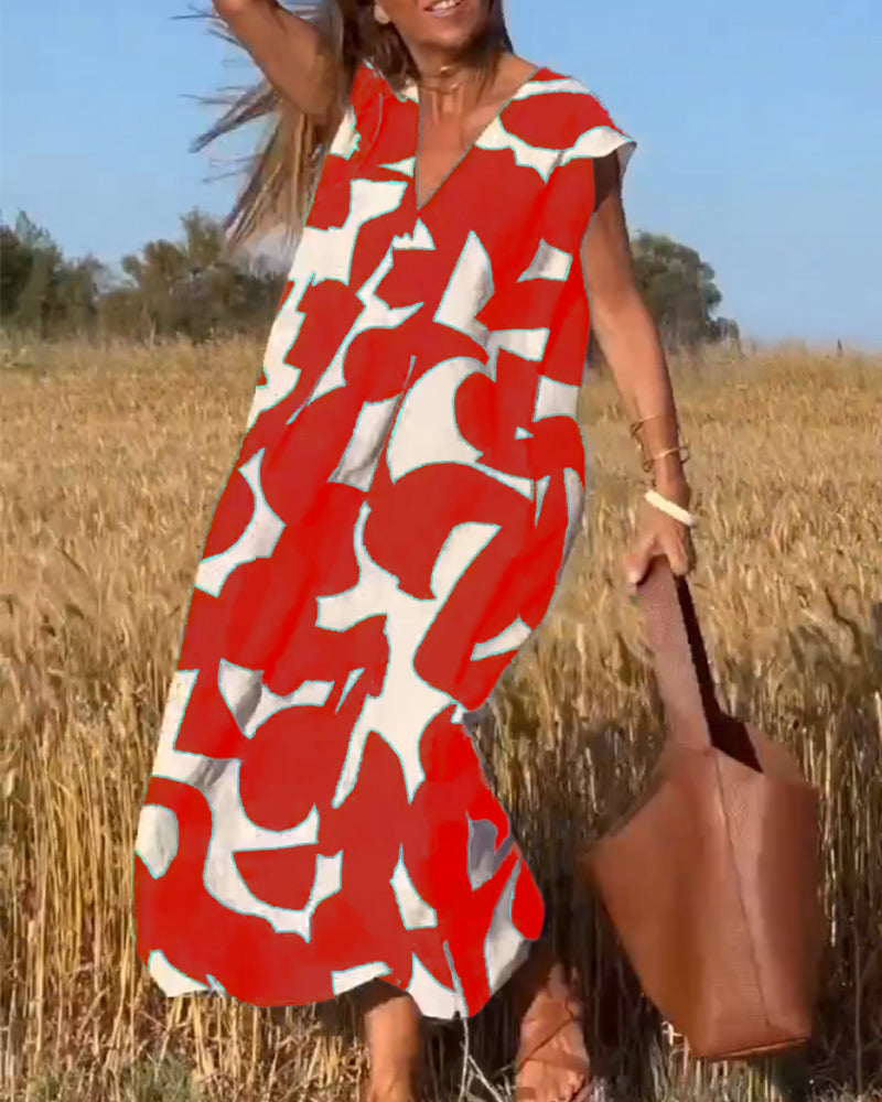 NAOMI™ | Lange Geprinte Jurk met V-hals en Uitlopende Pasvorm voor een Zomerse Look