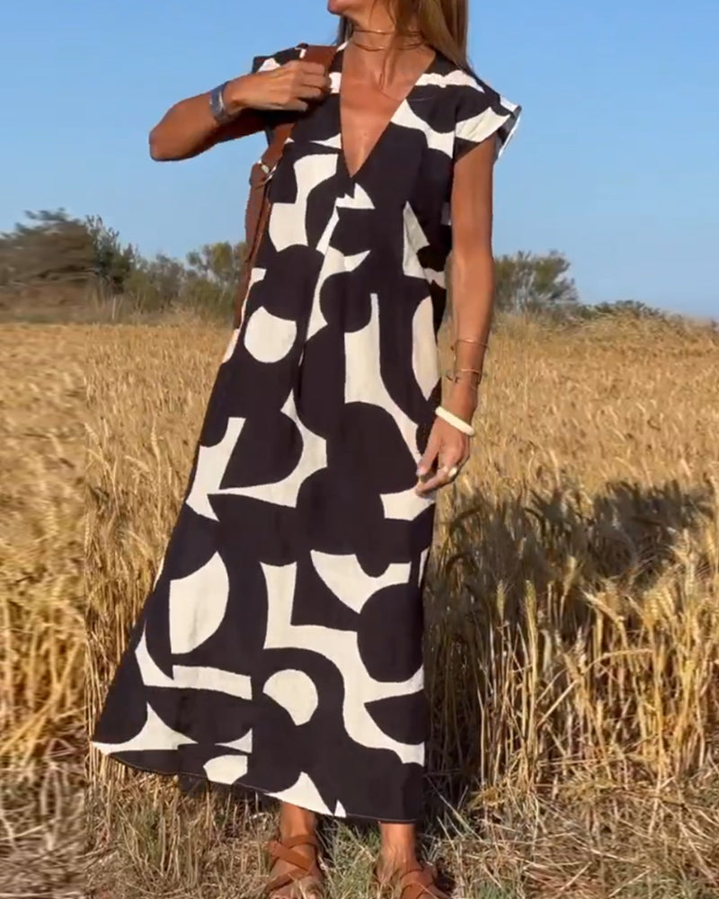 NAOMI™ | Lange Geprinte Jurk met V-hals en Uitlopende Pasvorm voor een Zomerse Look